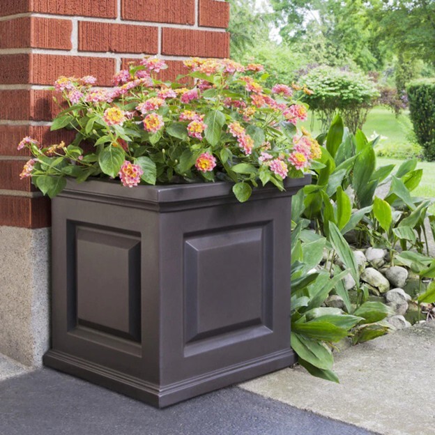 Presidential Planter in Graphite Gray planted with pink and yellow flowers